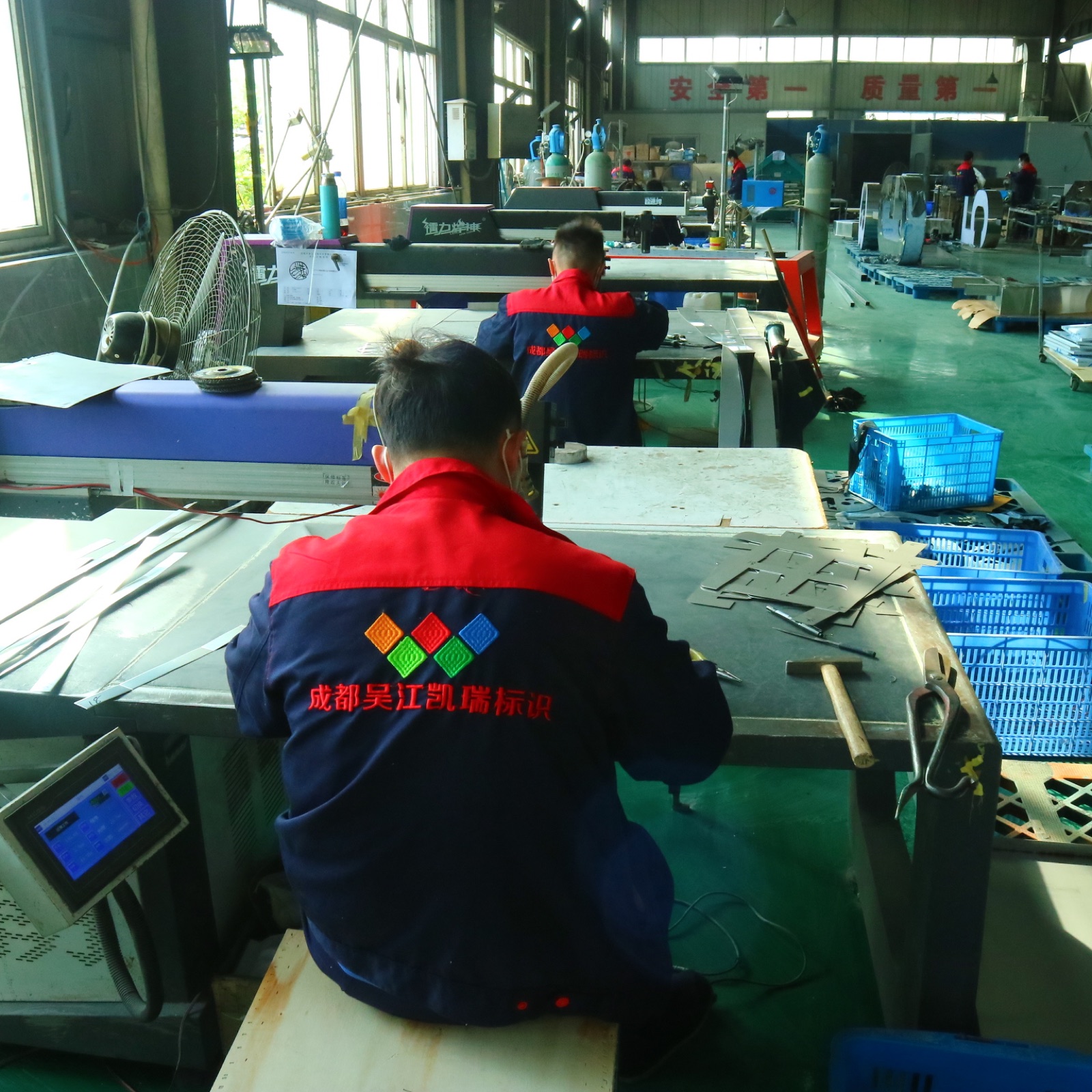Carrey Sign craftspeople working in the factory